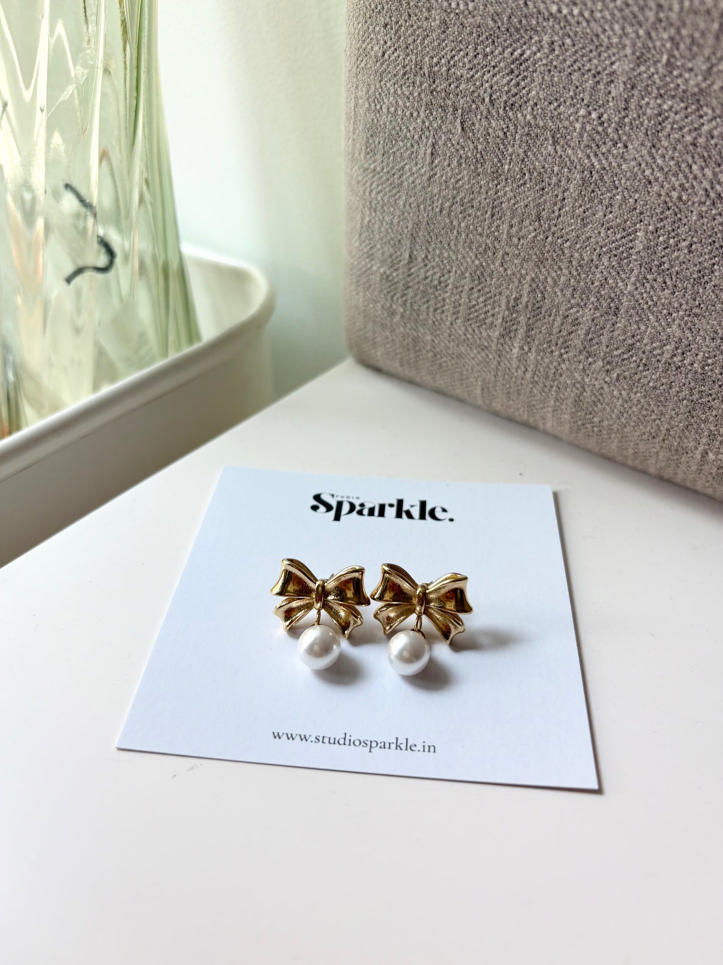 Bow pearl drop earrings