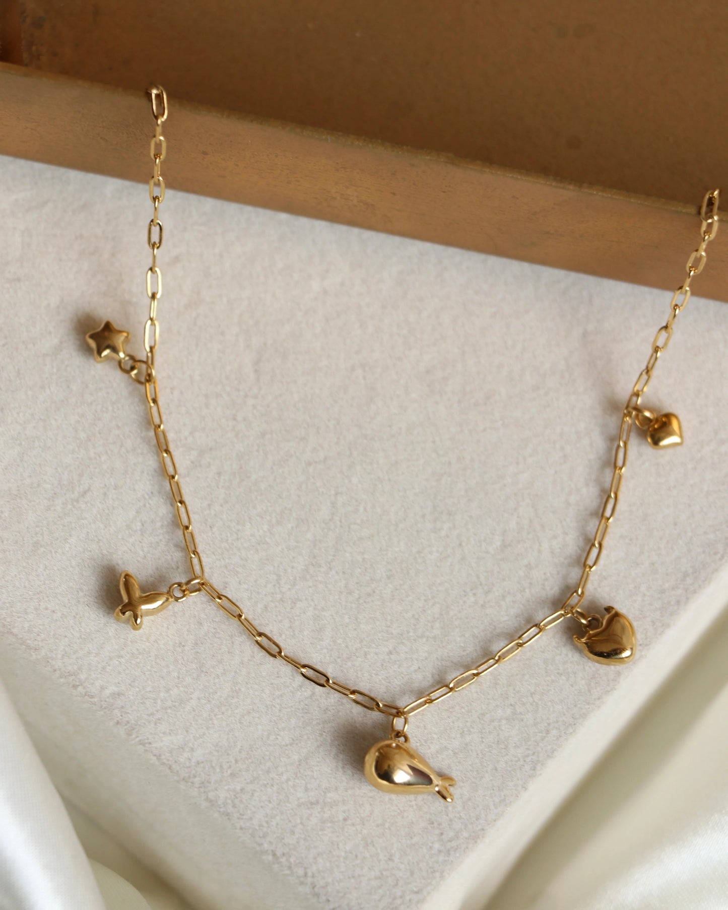 Gold whale mini charm necklace