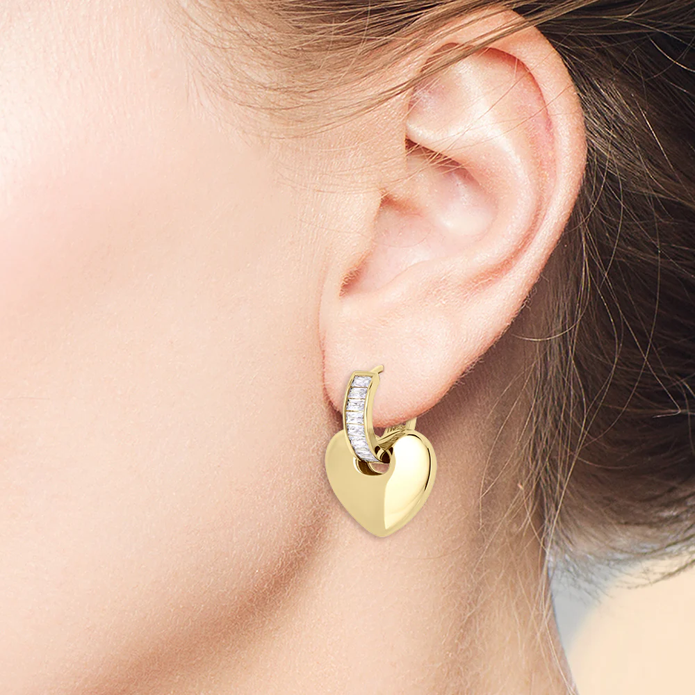 Minimal gold huggie earrings side profile