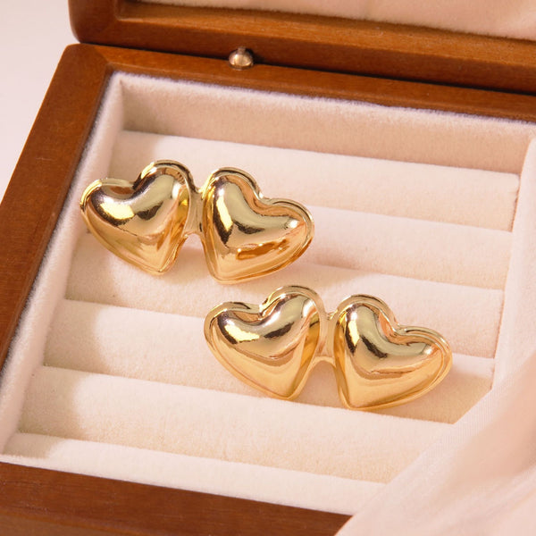 Front view of Dual Heart Earrings with interlinked heart pendants