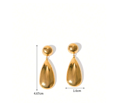 Gold water drop earrings worn for styling