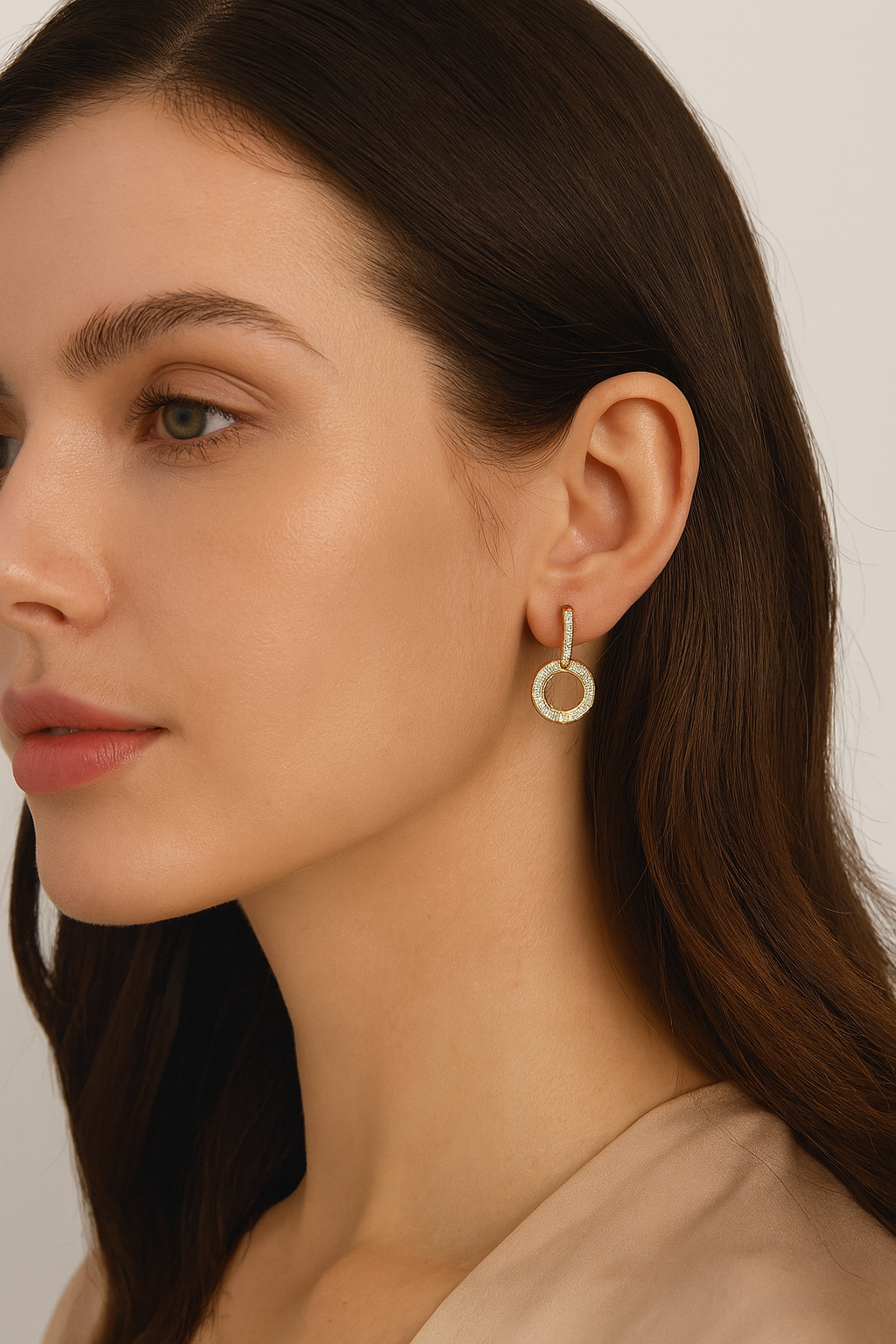 Side angle of Infinity Glow gold earrings